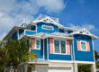 Large Beach House with Blue, White, and Pink Paint